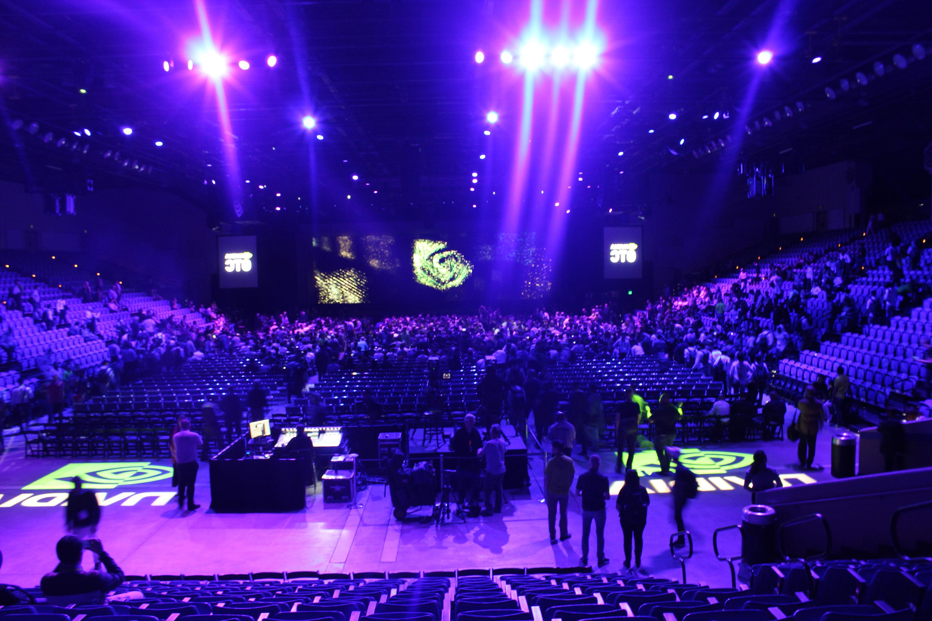 Picture of NVIDIA set up in Event Center with purple lighting and audiovisual setup.